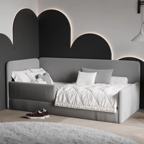 szare łóżko tapicerowane dla dziecka z barierką ochronną